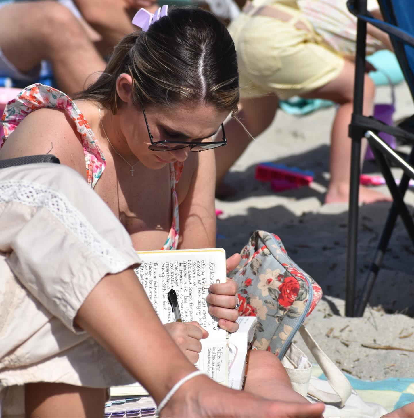 Congregant journaling notes during Sunday service